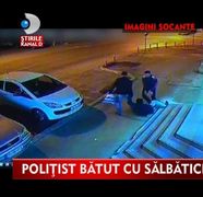 IMAGINI SOCANTE! Politist batut cu bestialitate in plina strada VIDEO